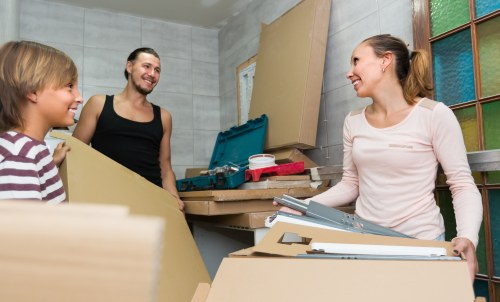 Loading items into a moving van for a Surrey man with van service