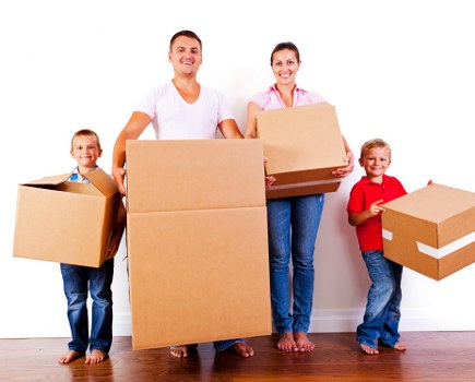 Local Surrey house moving team planning a move with boxes and furniture