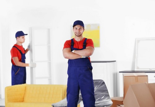 Removal team planning a house move in Surrey with boxes and furniture