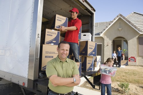 Removal van and packed boxes for a Surrey home move