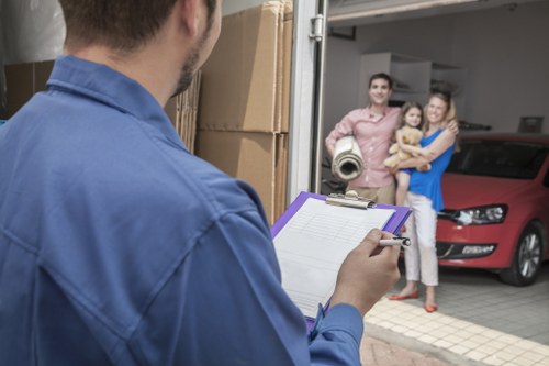 Local removal team loading items into a van in Surrey