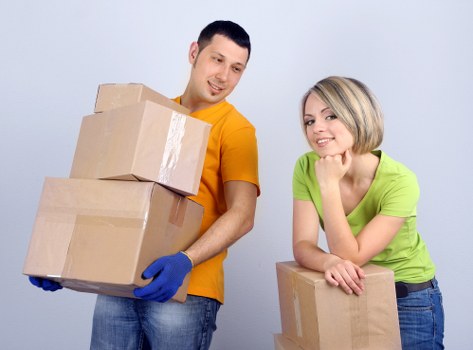 Loading household items into a van for a Surrey collection