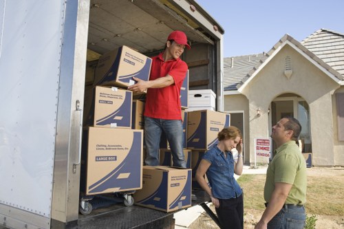 Man and van loading furniture for a Surrey home move