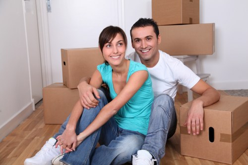 Office movers loading equipment for a Surrey relocation