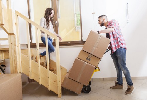 Removal crew handling business equipment and office items
