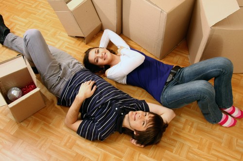 Movers handling items at a Surrey residential property